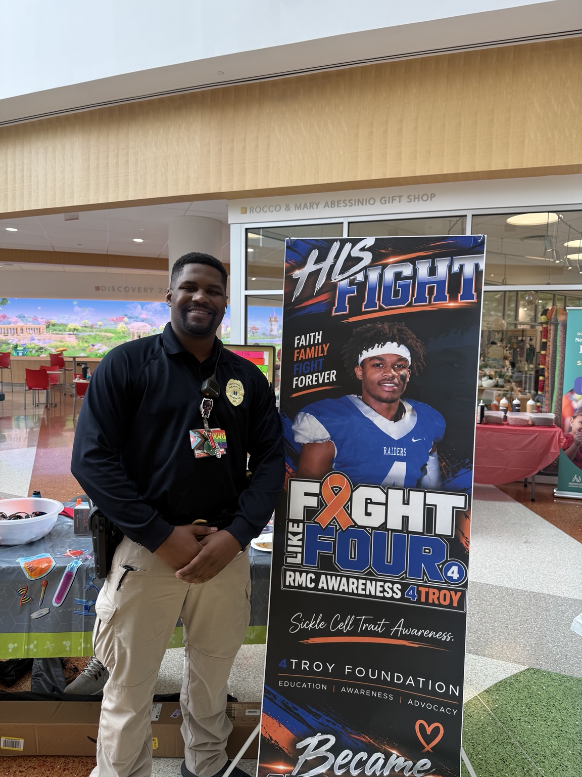 Supporter beside the 4Troy awareness banner