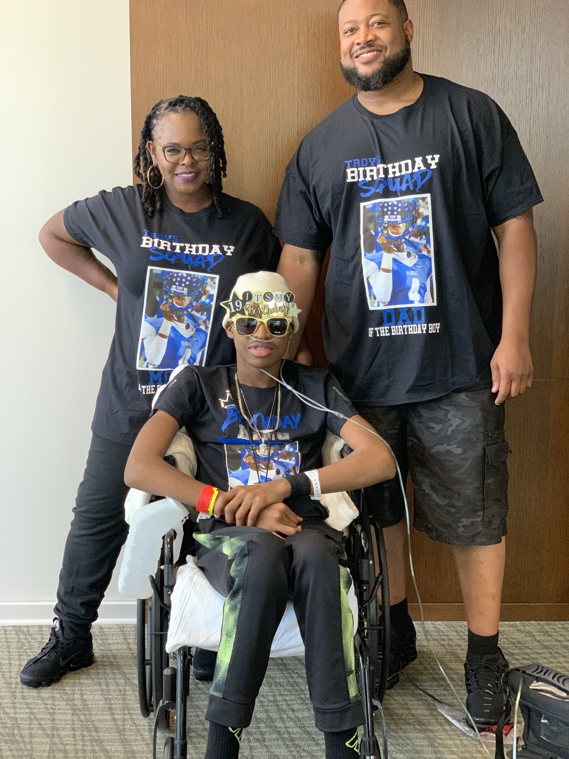 Troy with his parents on his nineteenth birthday