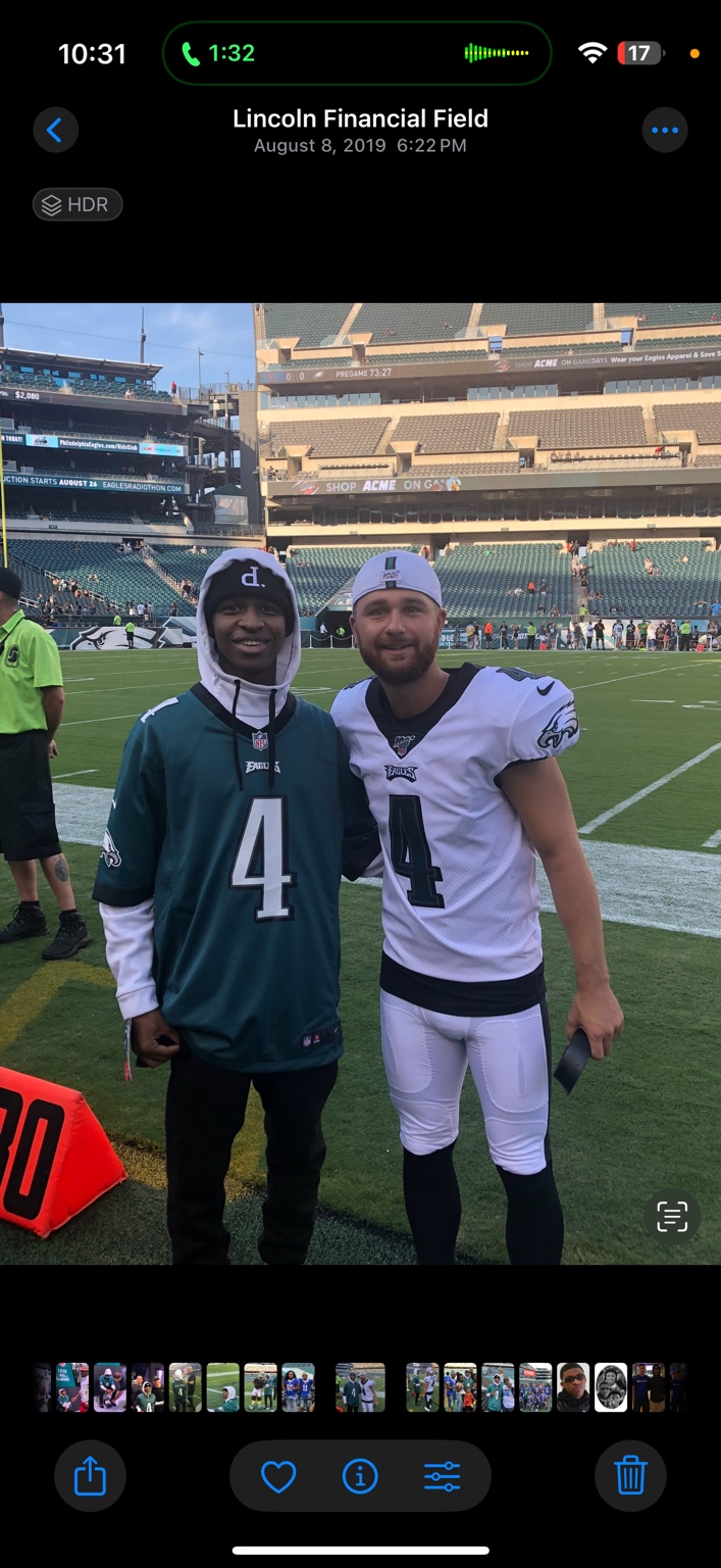 Troy with an Eagles player on the field