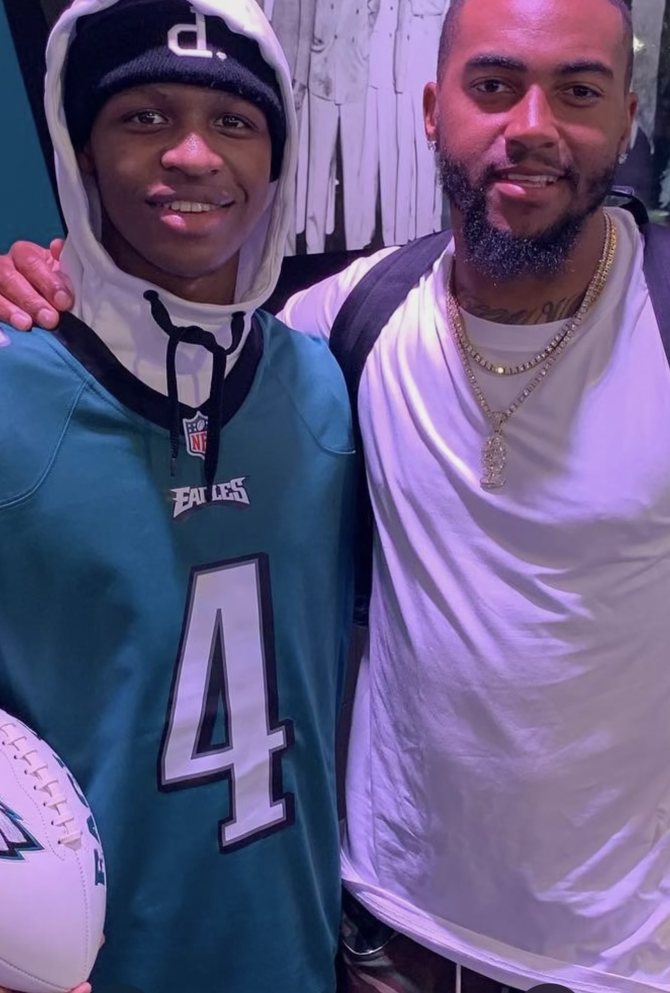 Troy in an Eagles jersey with a friend