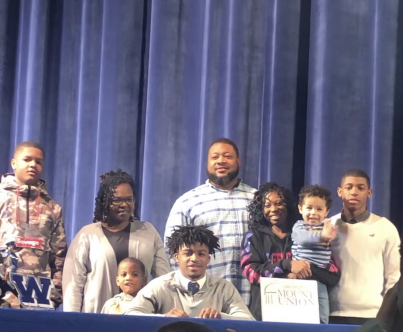 Troy with family at his college signing