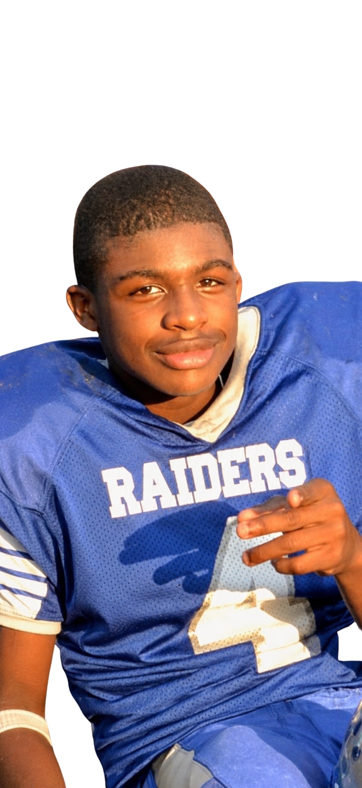 Young Troy in his blue Raiders football uniform